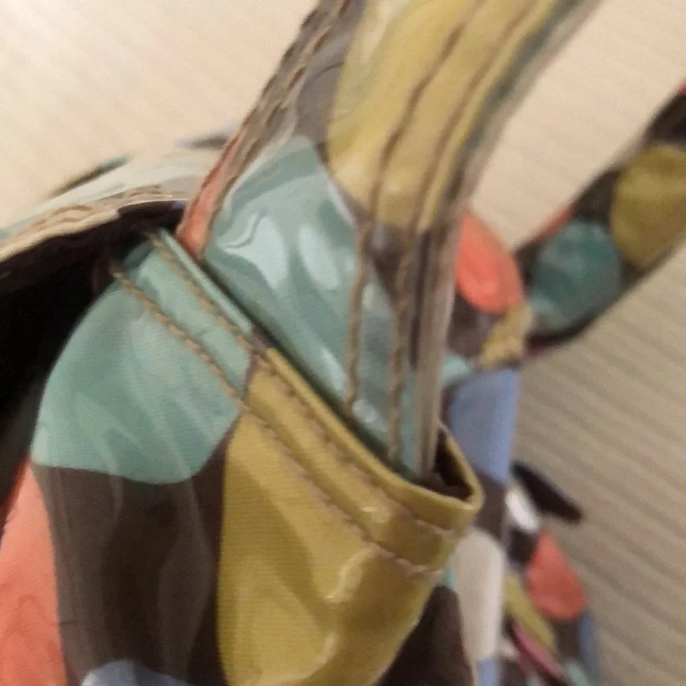Multi colored easy wipe pokadot kalencom diaper bag